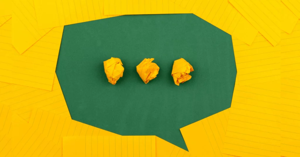 Illustration of a green speech bubble on a yellow background