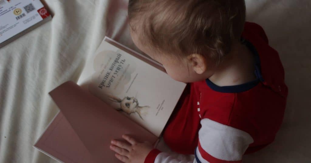 Photo of a child reading a book