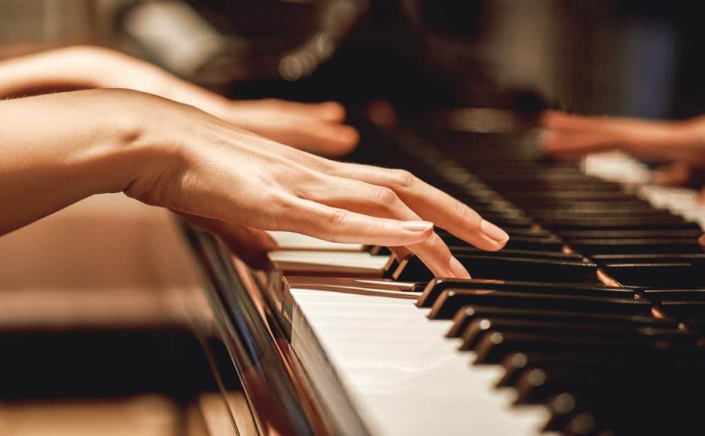 Picture of hands playing a piano
