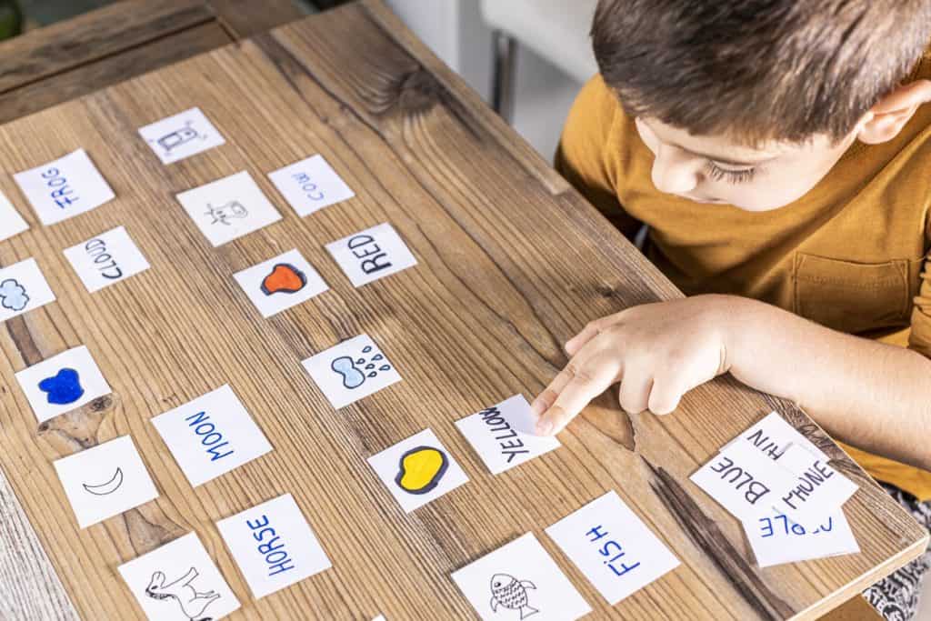 A young student playing language learning games